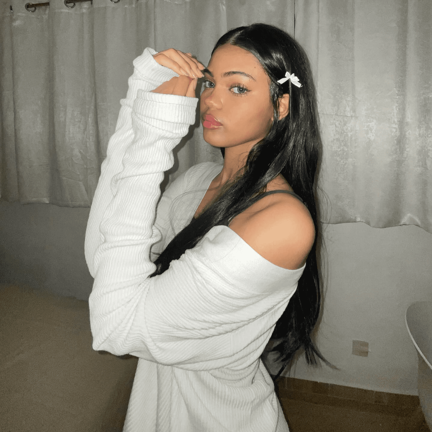 silken strands with ribbon accents