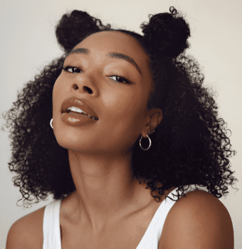 natural curls with double bun