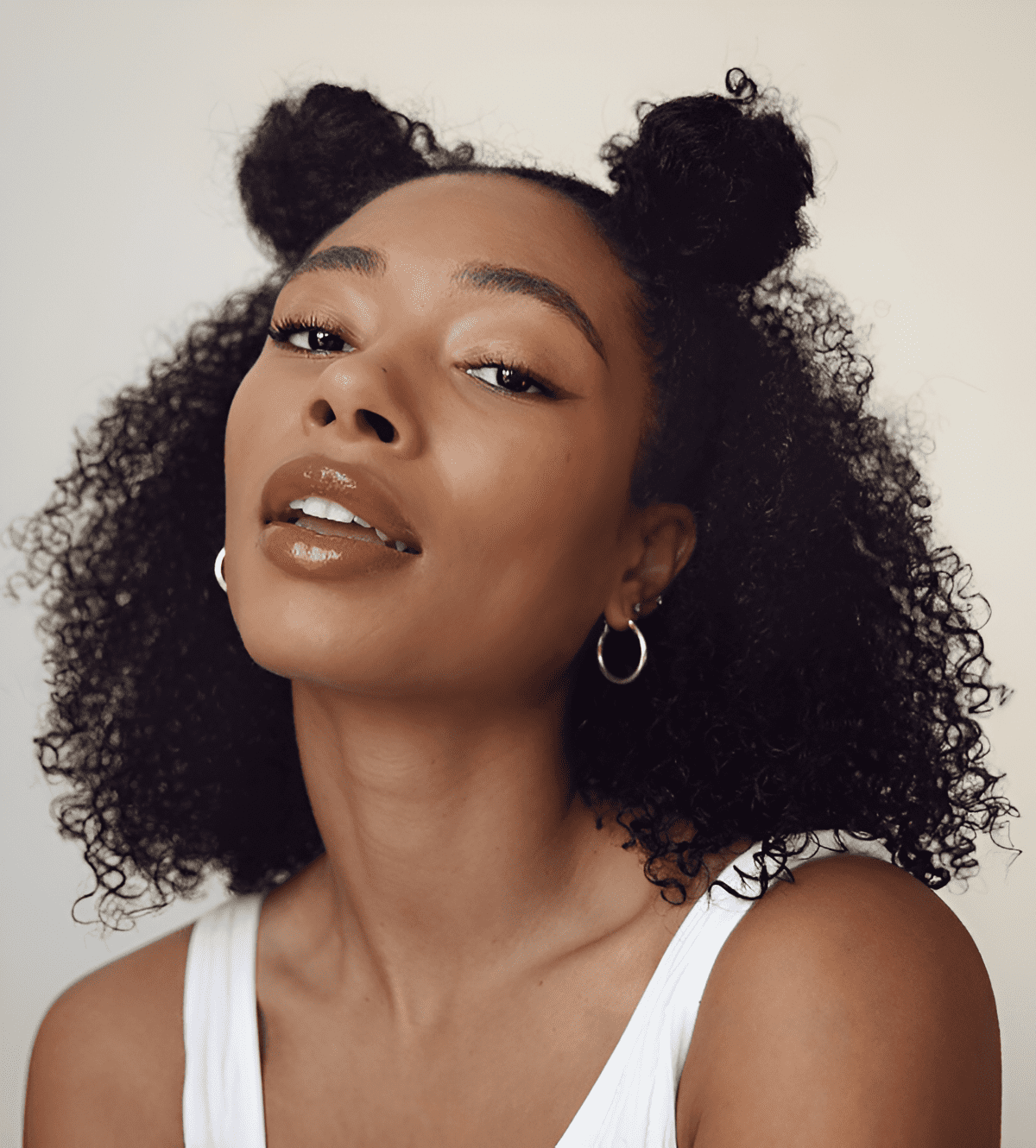 natural curls with double bun
