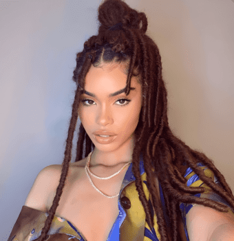 boldly textured locs high bun