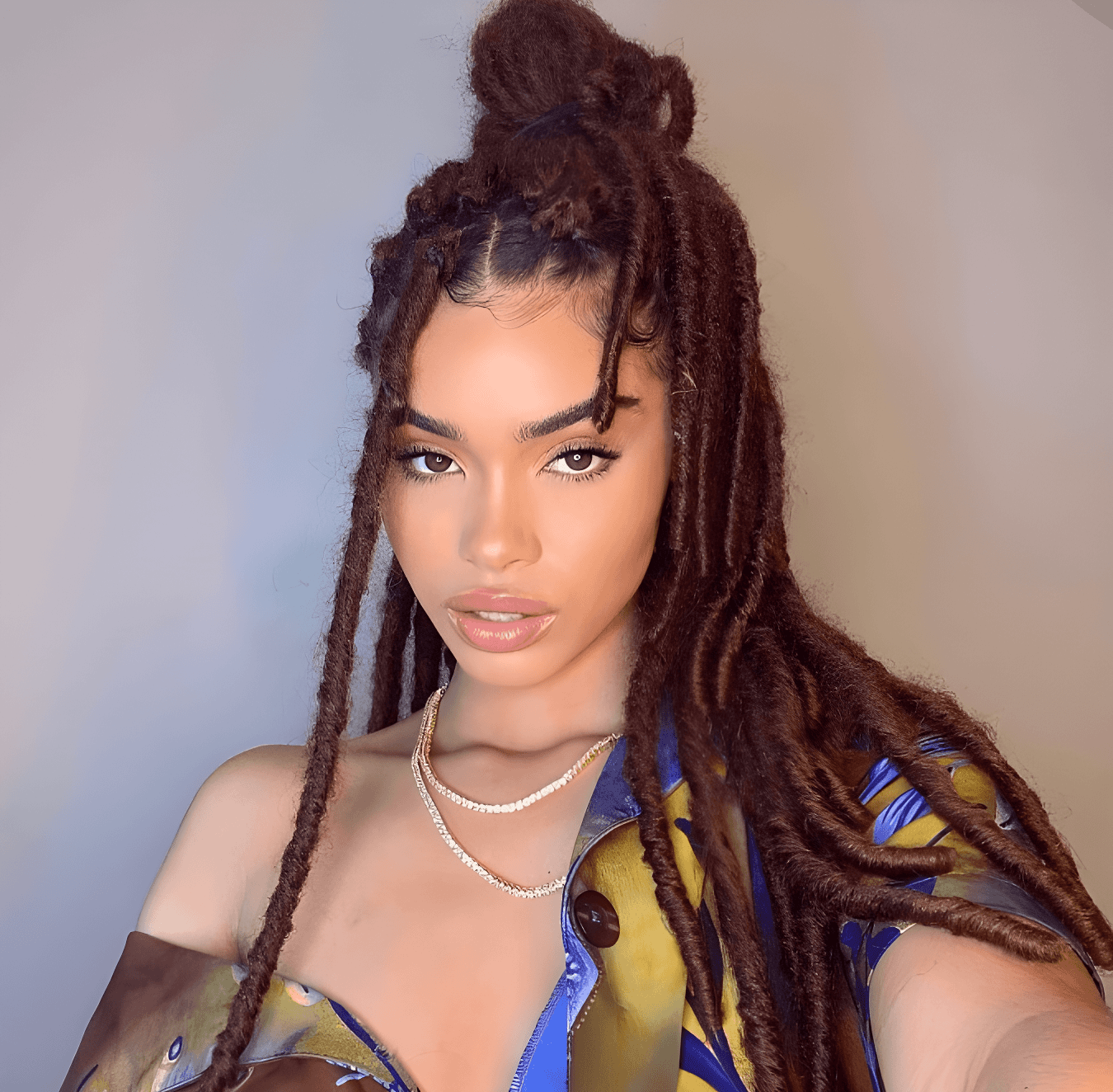 boldly textured locs high bun