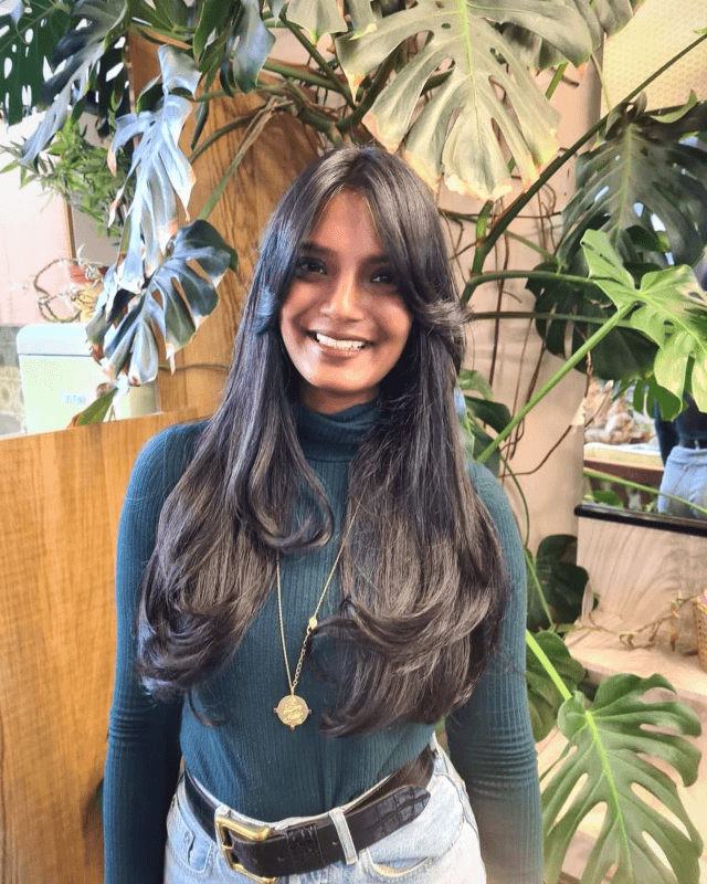 Curtain Bangs That Take Her Long Hair Beyond Belief